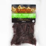 Glenwood Beef Jerky Spicy Hot 230g in clear resealable bag with mountain label and visible jerky pieces.