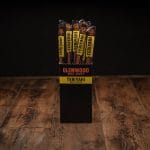 Glenwood Teriyaki meat sticks display box on rustic wooden table with bold black and yellow branding.