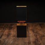 Closed Glenwood Honey Habanero Meat Sticks display box on a rustic wooden surface.