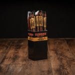 Glenwood Honey Habanero meat sticks display box on rustic wood table with individually wrapped sticks.