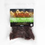 Glenwood Beef Jerky Spicy Hot 80g in clear resealable bag with mountain label and visible jerky pieces.