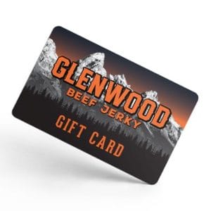 Glenwood Beef Jerky gift card with mountain design tilted on white background.