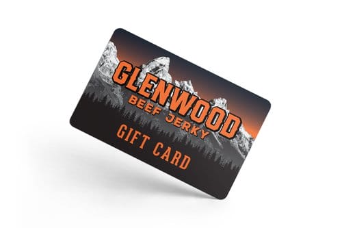 Glenwood Beef Jerky gift card with mountain design tilted on white background.