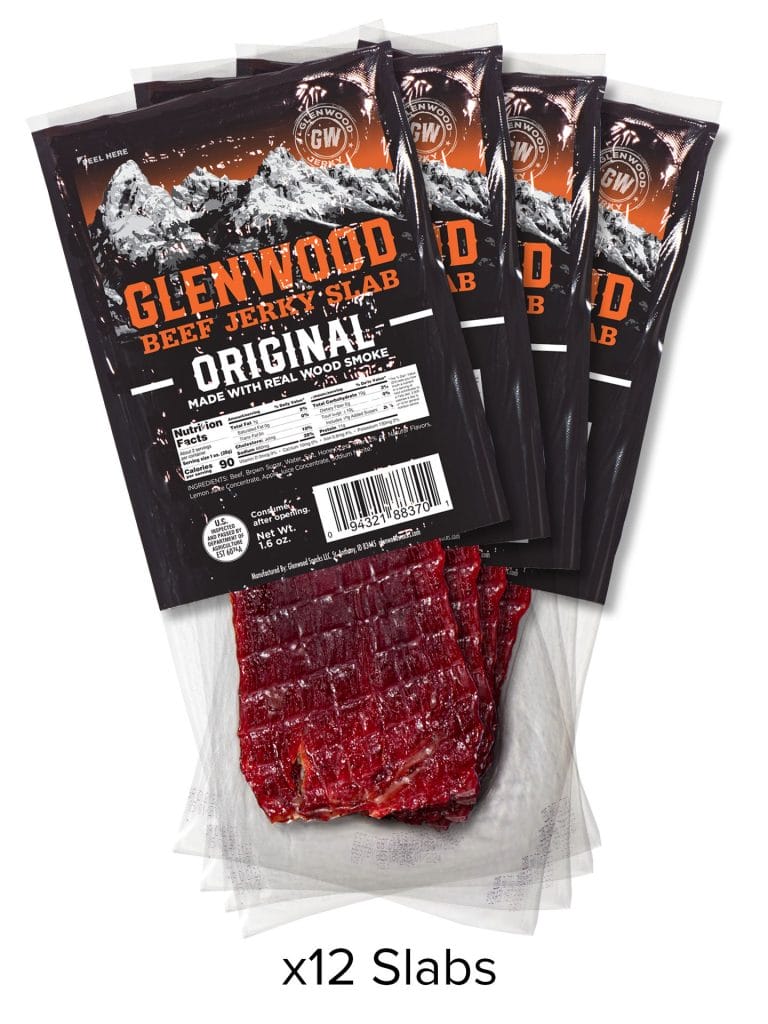 Glenwood Original Beef Jerky Slab 12-pack with mountain design packaging and visible jerky pieces.