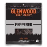 Glenwood Beef Jerky Peppered flavor packaging with forest silhouette and bold orange logo.