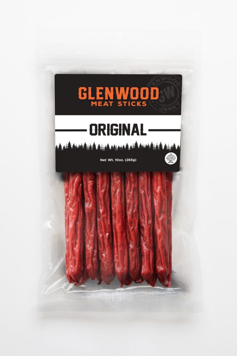 Original meat sticks on slate with apples, lemon, brown sugar, and honey.