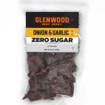 Glenwood Onion & Garlic Zero Sugar beef jerky 6oz package with dark jerky pieces in clear sealed bag.